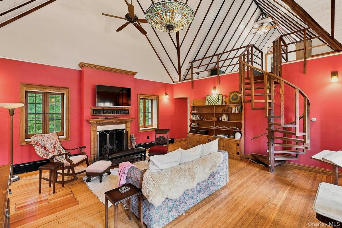 Family room on second floor with spiral staircase access to loft