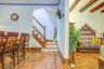 Stairs to second floor, bedrooms and primary bathroom.  Top floor also has a skylight and access to roof.