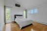 The largest of the other three bedrooms, this corner room with nearly floor to ceiling windows has a deep closet. Vaulted ceilings in this space soar 