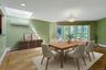 The spacious dining room is graced by a large skylight and wall of windows overlooking the private pool. As in most other rooms in the home, the split