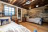 Bedroom with reclaimed wood and flush mount lights