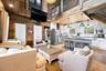 Open-concept living space with an exposed beam ceiling