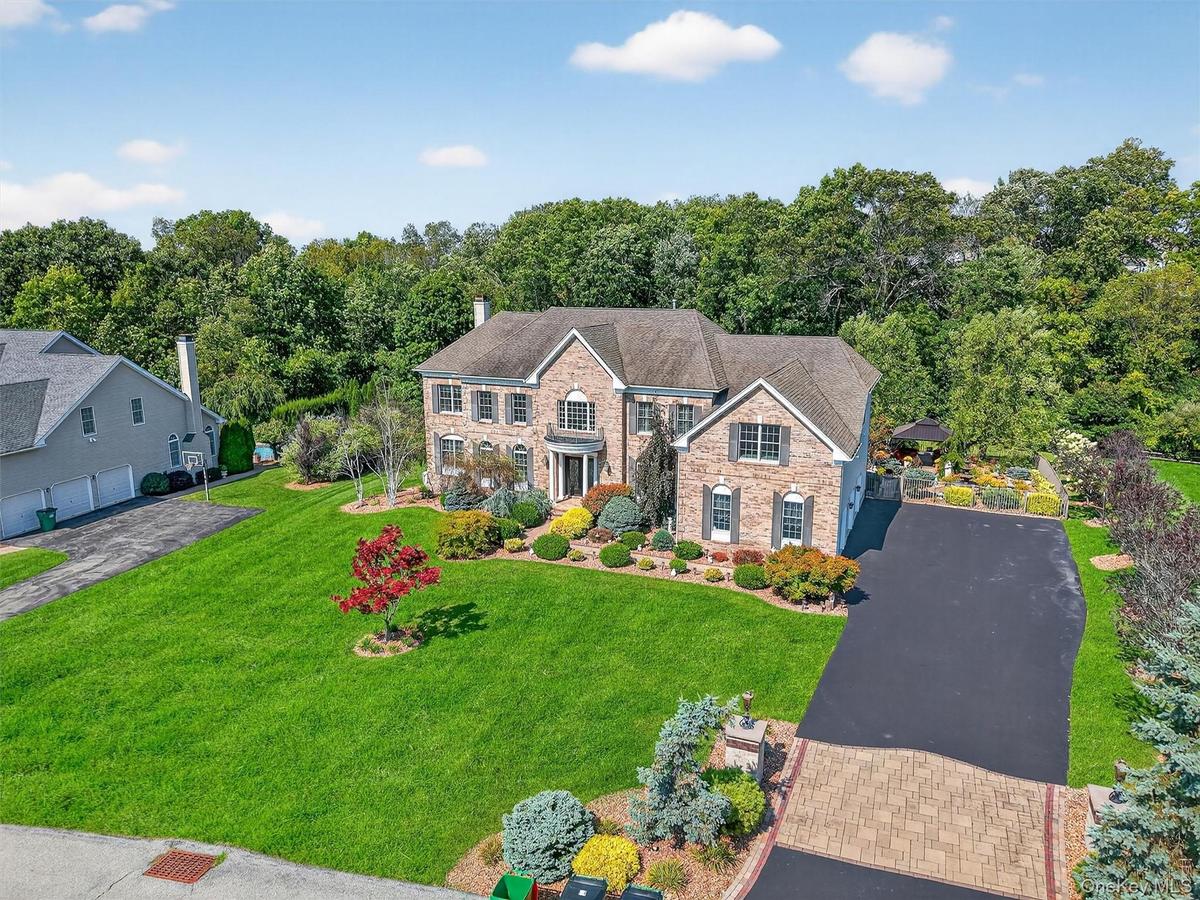 Welcome to your FOREVER home! A commuters dream, under 5 miles to Metro North train just 75 miles from Manhattan, this magnificent custom Colonial sta