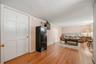 Finished bonus room with hardwood floors and flexible living space.