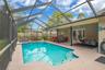 Screened-In Solar Heated Pool with covered seating area