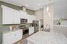 41" raised panel cabinets w/ quartz countertops