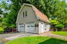 Detached two-car garage with additional upper-level space.