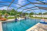 View of Custom Pool, Sun Shelf, Pool Cage