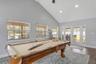View of Great Room and French Doors to Extended Covered Lanai, Patio, Summer Kitchen, and Custom Pool