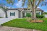 Front of 4 Bedroom Pool Home with 3 Bathrooms, Remodeled Kitchen and Tons of Living Space!