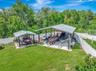 Aerial View of Two Covered Open Air Storage Areas with Concrete Pads, Firepit, Shed and enough parking for all of your toys!