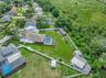 View of Backyard, Playground, Two Covered Open-Air Structured Storage areas with Concrete Pads, Firepit, and Shed. Bring the Boat- Bring the Toys - Th