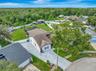 Aerial View of 4 Bedroom Pool Home with extended driveway, side driveway, tons of parking for RV, Boats, Toys, and more!