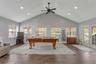 Great Room with Vaulted Ceilings, LVP Flooring, Dual Fans, Recessed Lighting; Tons of Windows, Natural Light, French Doors to your Patio & Covered Lan