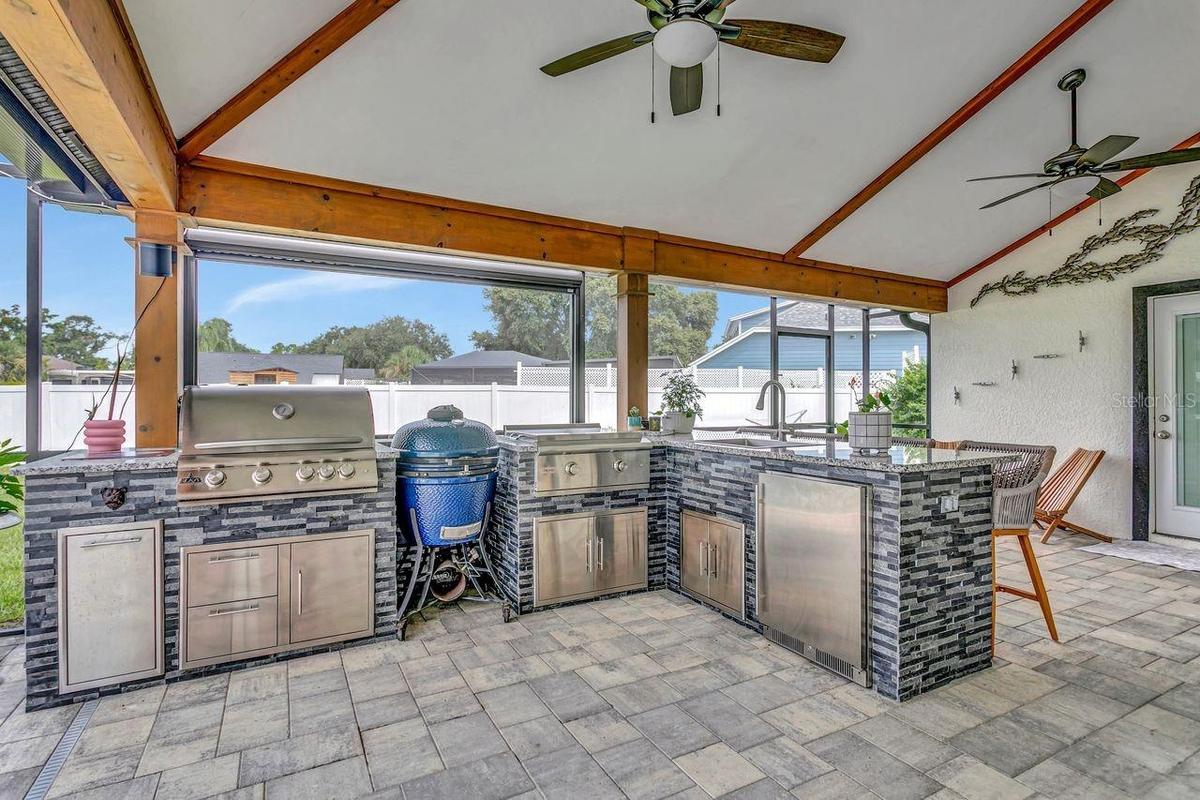 Summer Kithen with full stainless appliances, refrigerator, grill, etc.