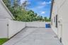 Driveway and expanded driveway area, Home fully fenced, and Double Gates for parking all your toys!