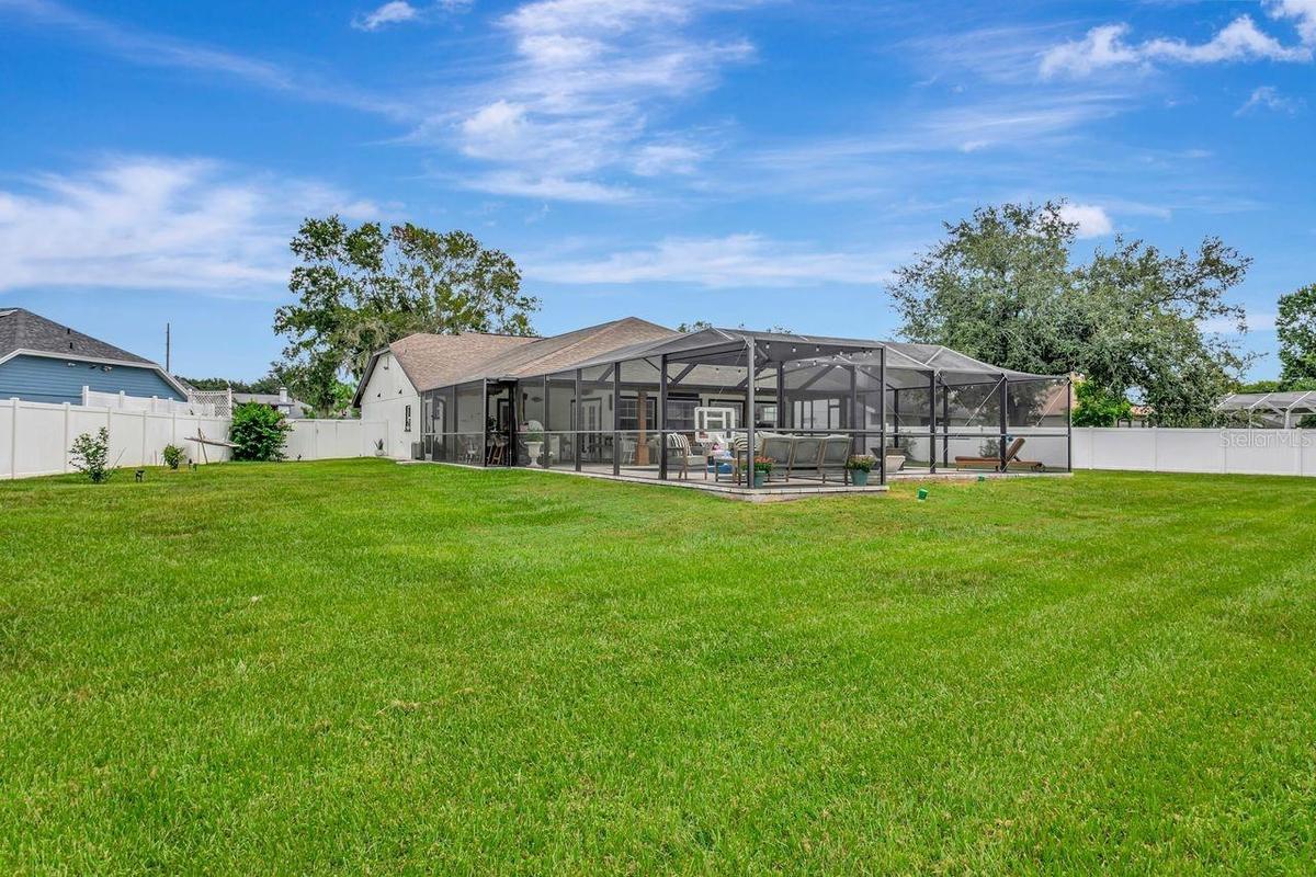 View of Back of Home, Side Yards, Fully Fenced, Pool and Pool Cage
