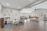 View of Great Room with Vaulted Ceilings and Flex Space adjacent to the Kitchen - May serve as Formal Dining, Play Room, Office Space, etc.