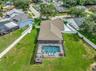 View of Backyard, Playground, Two Covered Open-Air Structured Storage areas with Concrete Pads, Firepit, and Shed. Bring the Boat- Bring the Toys - Th