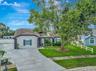 Aerial View of Home; Expanded Driveway; Sidewalks; Mature Landscaping; Double Gates; and More!