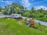 Aerial View of Fully Fenced Backyard; No Rear Neighbors; Preserve; Playground and RV that BOTH CONVEY with Home!