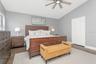 Primary Bedroom with LVP Flooring; Upgraded Ceiling Fan; En-Suite Bathroom; Dual Closets