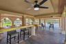 Waterfront-oriented outdoor bar and entertaining area.