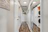 Interior hallway with convenient access to the laundry area.