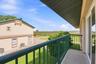 Side balcony with views across the coastal marshlands.