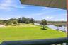 Waterfront grounds with broad lawn area and direct water frontage.