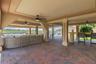 Expansive covered outdoor living and entertaining area beneath the residence.