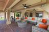 Additional perspective of the covered patio and multiple seating areas.