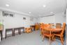 Recessed lighting, light-toned walls, and carpet flooring