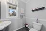 An updated half bath completes the first floor.