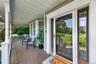 A charming wraparound rocking-chair porch provides the perfect spot to relax and unwind.