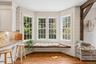 A charming window seat completes the eat-in kitchen.