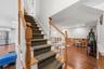 Stairs from the first floor descend to a beautifully finished basement.