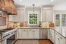 The kitchen boasts of high-end, stainless steel Thermador appliances.