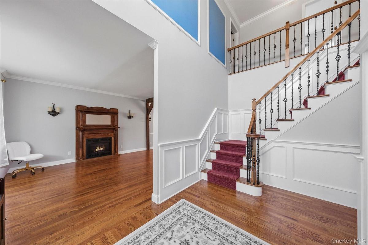 The foyer flows seamlessly into a large living room.