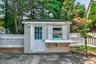 An additional pool shed offers convenient storage for pool equipment, maintenance supplies and floats.