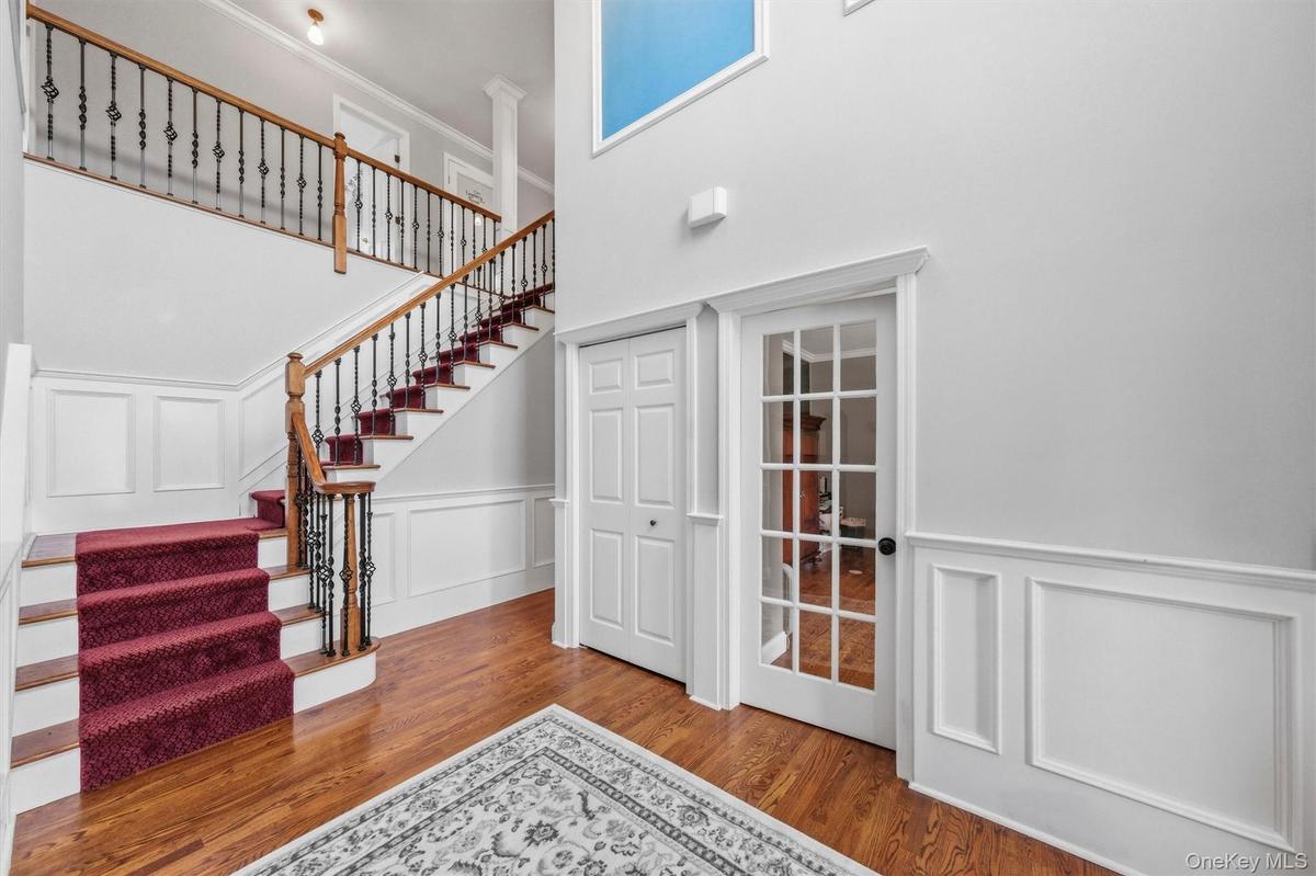 Enjoy a full home office (on the right), along with a large coat closet and easy access to the second floor.