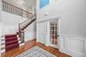 Enjoy a full home office (on the right), along with a large coat closet and easy access to the second floor.