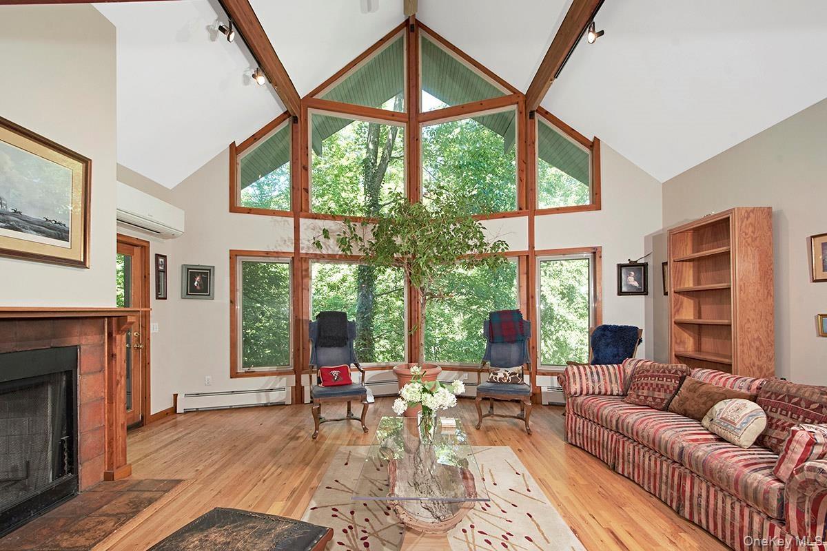 Wall of windows and hardwood floors.