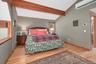 Loft style primary bedroom suite.