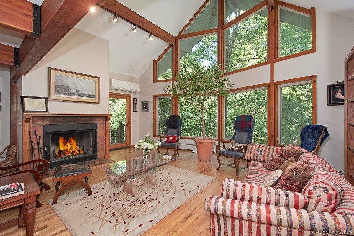 Living room with wood burning fireplace.