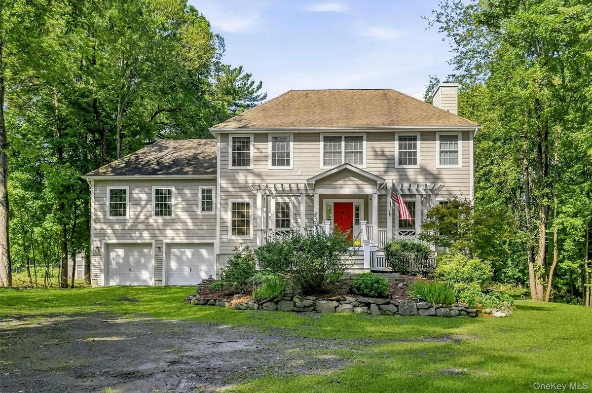 Welcome to 9 Short Road--a stunning colonial nestled along the shores of Beaverdam Lake.