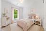Virtually staged. Bedroom 2 is generously sized and conveniently located near a full guest bathroom.