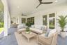 Virtually staged covered paver lanai.
