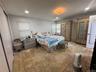 Primary Suit e With Full Bathroom and Door to Backyard.