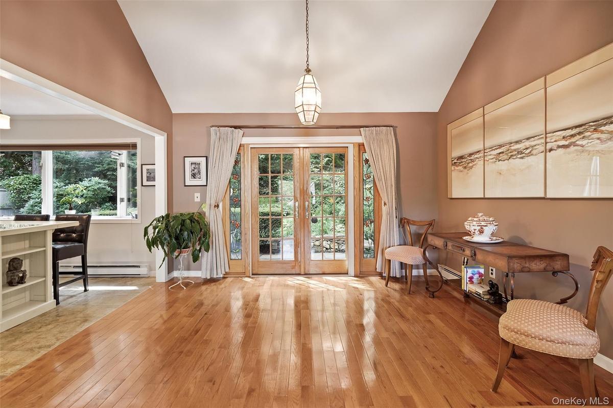 Dining area opens to kitchen and French doors to patio
